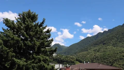 Time Lapse of a beautiful Landscape with Mountains and Clouds Stock Footage 133433258