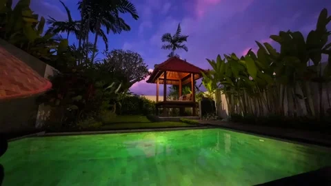Time-lapse With beautiful lighting from the pool and gazebo in Asian style. Stock Footage 231395360
