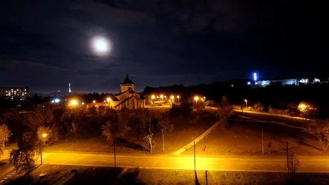 Time lapse: beautiful moon lighting on clouds floating by night sky. Stock Footage 120064481