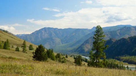 A time-lapse of beautiful mountain landscape in a summer day. Zoom in video Stock Footage 46636156