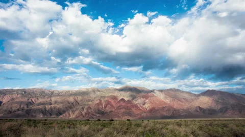 Time Lapse - Beautiful Moving Clouds Over Rocks and Mountains, zooming in Stock Footage 53089926