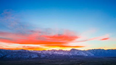 Time Lapse - Beautiful Orange Clouds at Sunset Over the Valley Stock Footage 60758493