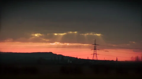 Time lapse of a beautiful orange sunset with the silhouette of an electricity 스톡 동영상 32961569
