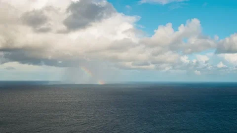 Time Lapse - Beautiful rainbow and rain on the ocean Video stock 141429689