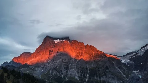 Time lapse of a beautiful red sunset at Wetterhorn mountain peak in Swiss Alps. Stock Footage 104904430