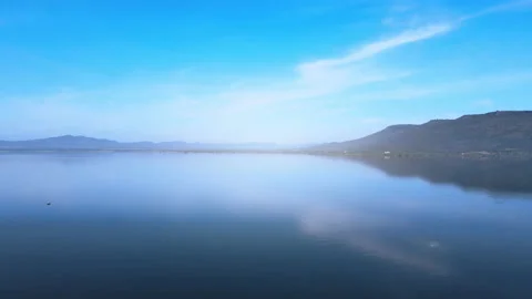 Time lapse of beautiful reflection of the mountain is in the clear water and bea Stock Footage 164714066