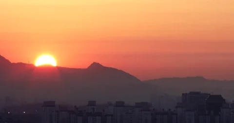 Time lapse of beautiful rising behind mountain : 4K Footage Stock Footage 72967594