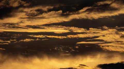 Time lapse of the beautiful scenery of the sunset sky with the golden rays Stock Footage 253834992