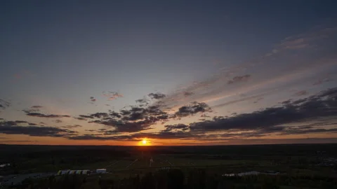 Time lapse of a beautiful summer sunset from a bird's eye view, 4k video Stock Footage 277180170