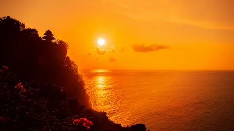 Time Lapse - Beautiful Sunset above the Sea at Uluwadu Temple in Bali - 4K Stock Footage 104998870