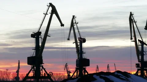 Time lapse beautiful sunset and working cranes . Video stock 59795413