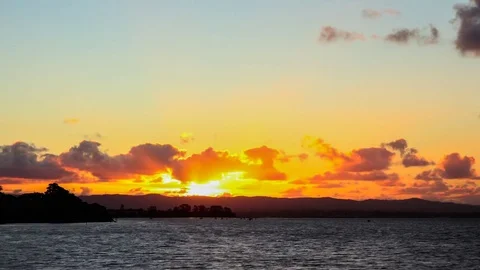 Time Lapse - Beautiful Sunset and Orange Clouds above the Sea Stock Footage 74948814