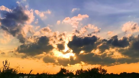 Time lapse beautiful sunset and fluffy storm cloudy blue sky Stock Footage 93467353