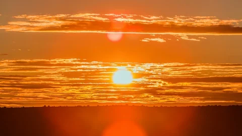 Time Lapse - Beautiful Sunset with Orange Clouds - 4K Stock Footage 88994773