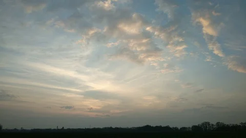 Time Lapse. Beautiful sunset with red clouds on the background of the field and Stock Footage 97797530