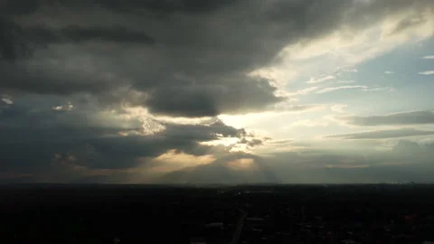 Time lapse of beautiful sunset sky with golden rays of sun and white clouds. Stock Footage 220168992