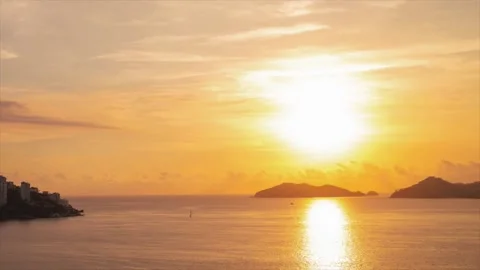 Time lapse with beautiful views of the peaceful ocean at mountainous sunset Stock Footage 153105255