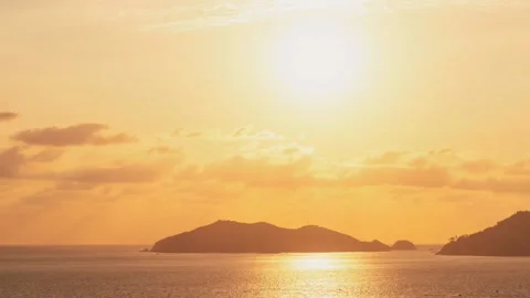 Time lapse with beautiful views of the peaceful ocean at mountainous sunset. Stock Footage 153105268