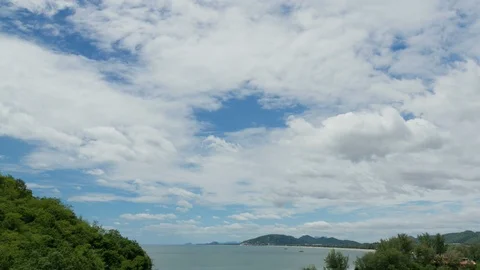 Time-lapse of the beautiful white cloud with a blue sky at seashore. Stock Footage 121132522
