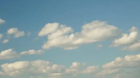 Time-lapse of beautiful white clouds moving over blue sky Stock Footage 11250575