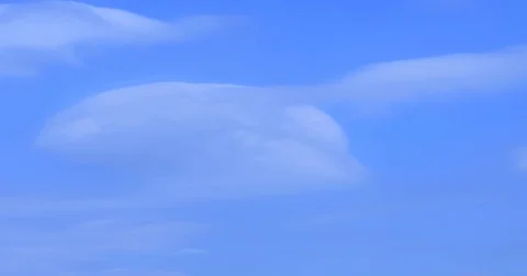 Time lapse of beautiful white fluffy clouds moving fast against blue sky Stock Footage 72858957