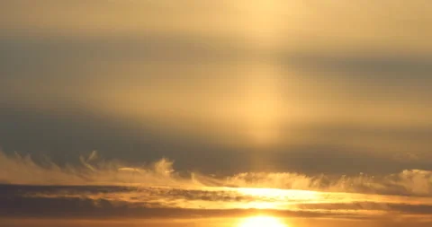 Time lapse of beautiful yellow sun rising from behind mountains Stock Footage 162711296