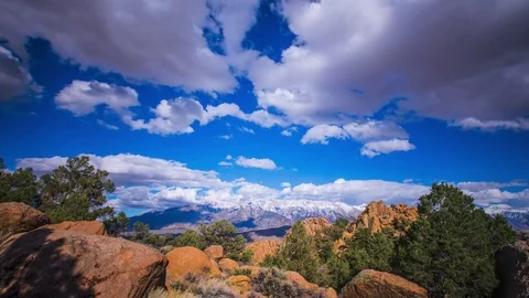 Time Lapse - Beautiul Clouds Moving Over Mountain Range and Valley Stock Footage 74247946