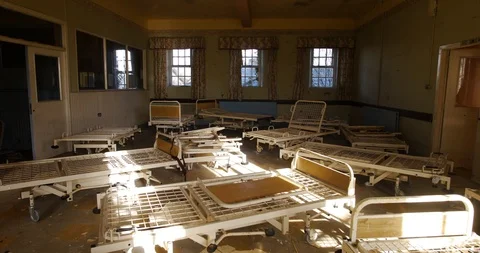 Time-lapse. Beds in an abandoned building, a mental hospital. Stock Footage 100415134