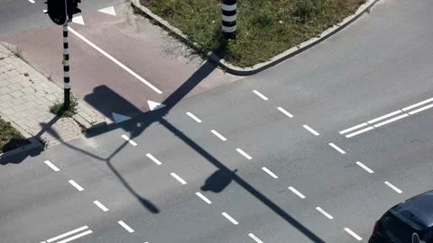 Time lapse of a bicycle path at intersection with crossing cars The Netherlands. Stock Footage 146727065