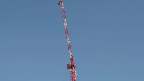 Time Lapse of Big Crane moving on blue sky background at Construction Site Stock Footage 248349542