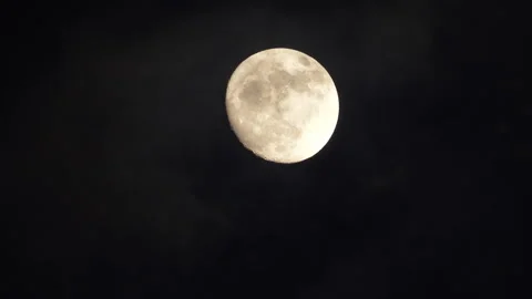 Time lapse of Big full moon behind moving clouds in 4K Stock Footage 124059027