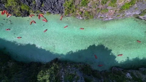 Time lapse Big Lagoon El Nido Palawan with kayakers. Fabulous aerial view drone Stock Footage 332823900
