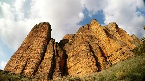 Time lapse of a big limestone cliff on a sunny day Stock Footage 48026920
