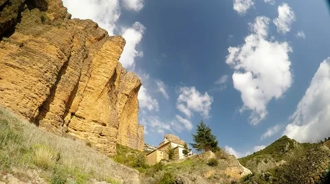 Time lapse of a big limestone cliff with small monastery in the village 스톡 동영상 48026947