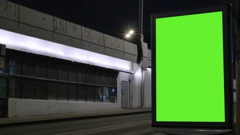 Time lapse. Billboard with a green screen, located on a busy street. Cars move Video stock 99548446