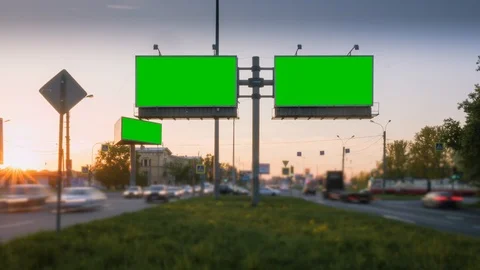 Time Lapse. A Billboard with a Green Screen on a Busy Night Street Stock Footage 99753856