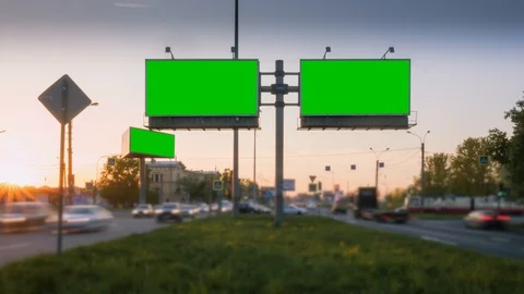 Time Lapse. A Billboard with a Green Screen on a Busy Night Street Stock Footage 99754651