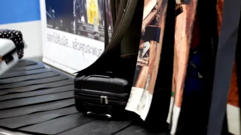 TIME-LAPSE Bird view of passengers picking up their baggage from the carous.. Stock Footage 256745339
