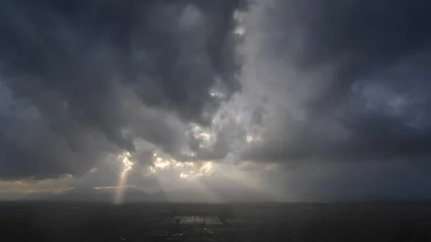 Time lapse black storm clouds over flooded plains after rain creating dramatic Video stock 333772302