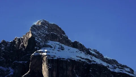 Time lapse of blowing wind over the snowy Sassongher mountain peaks, Dolomites Видео 101905871