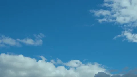 Time Lapse Blue Clear Sky and Puffy Clouds at Noon. Summer Cloudy Clear Skyscrap Stock Footage 220550810