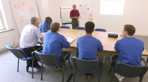 Time lapse of blue collar workers at a meeting or training seminar Stock Footage