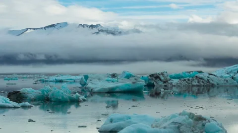 Time Lapse of blue icebergs floating in Jokulsarlon glacial lagoon Stock Footage 52222312
