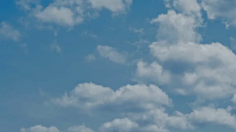 Time lapse of blue sky and white clouds moving around. Stock Footage 107182173