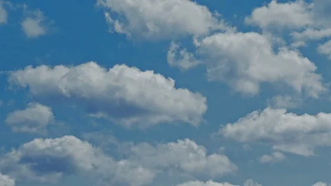 Time lapse of blue sky and white clouds moving around. Stock Footage 107182477
