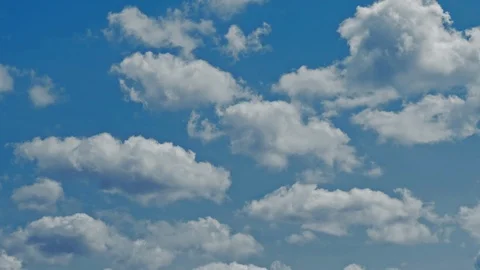 Time lapse of blue sky and white clouds moving around. Stock Footage 107182560