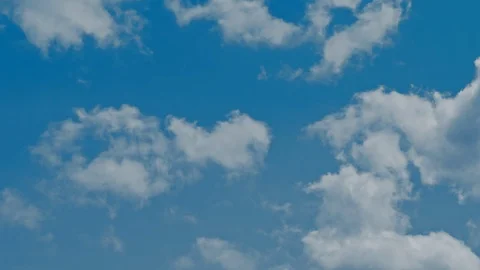 Time lapse of blue sky and white clouds moving around. Stock Footage 107184355