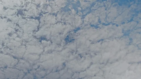 Time lapse of blue sky and white clouds moving around. Stock Footage 107185229