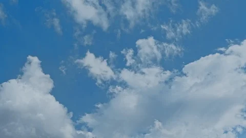 Time lapse of blue sky and white clouds moving around. Stock Footage 108540314