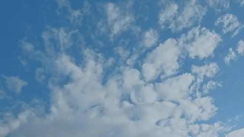 Time lapse of blue sky and white clouds moving around. Stock Footage 108541595